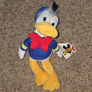 Old DISNEY Donald Duck Plush Toy with Red Bow